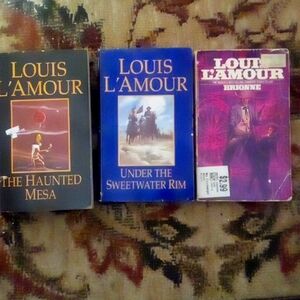 Three pre-owned vintage Louis L'Amour paperbacks